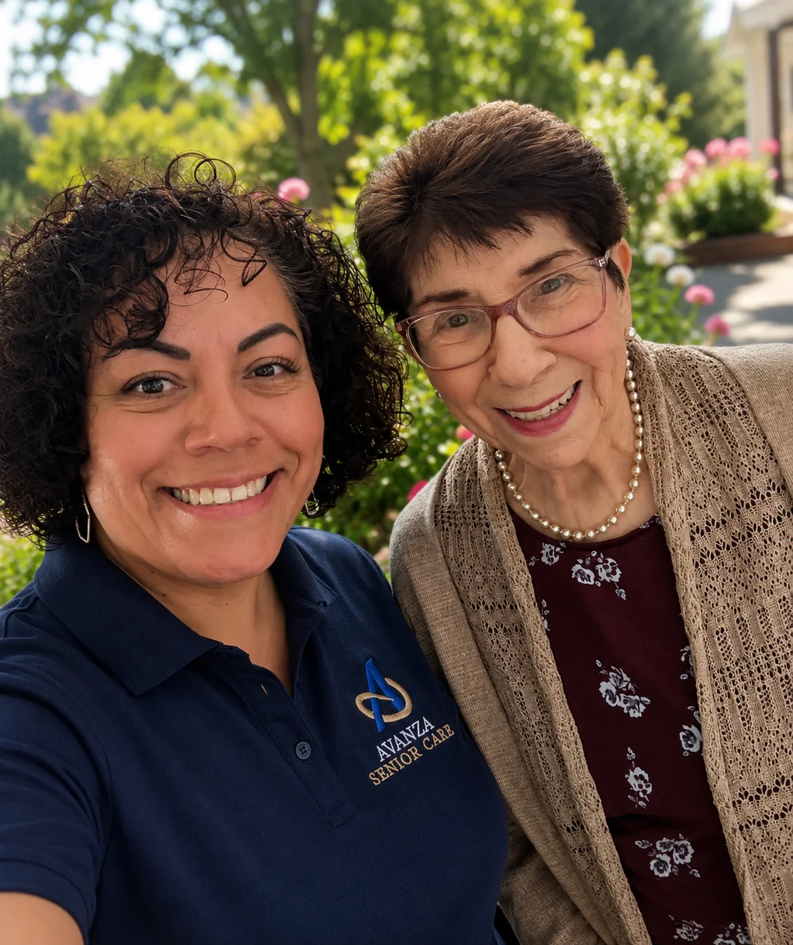 Avanza Senior Care caregiver smiling outdoors with a senior client in a garden